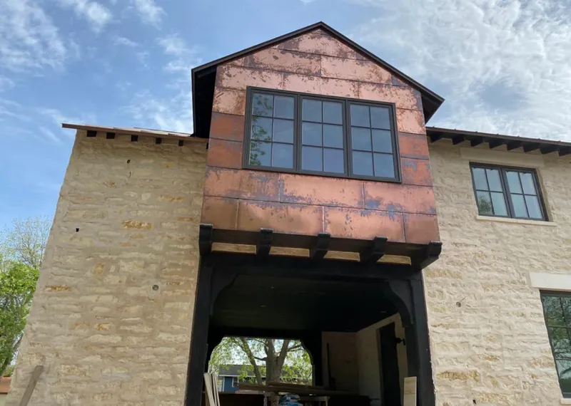 Copper metal panel facade on a stone building for Skylight Installation in Glen Carbon